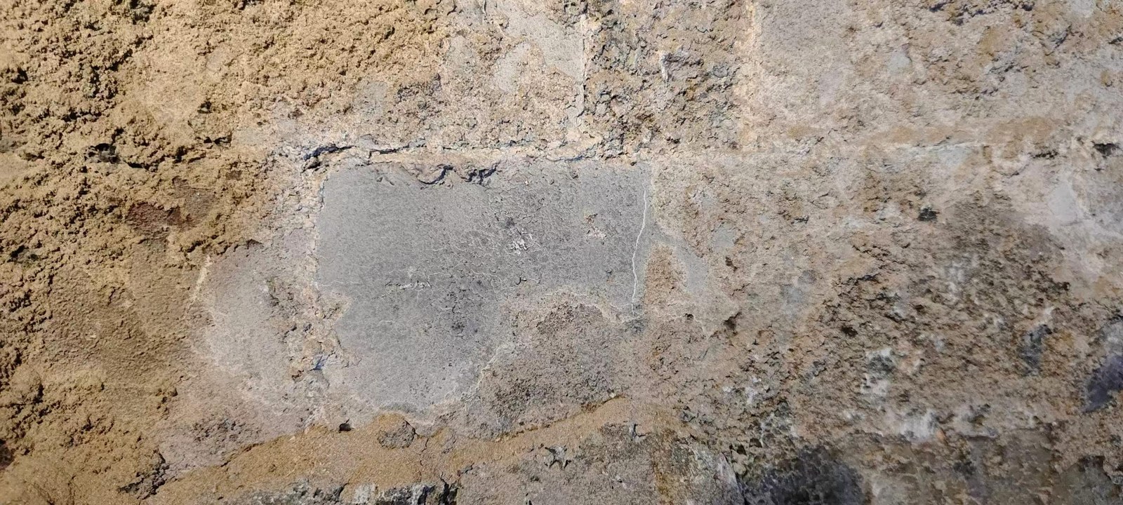 Thin deposit layer over intact coating