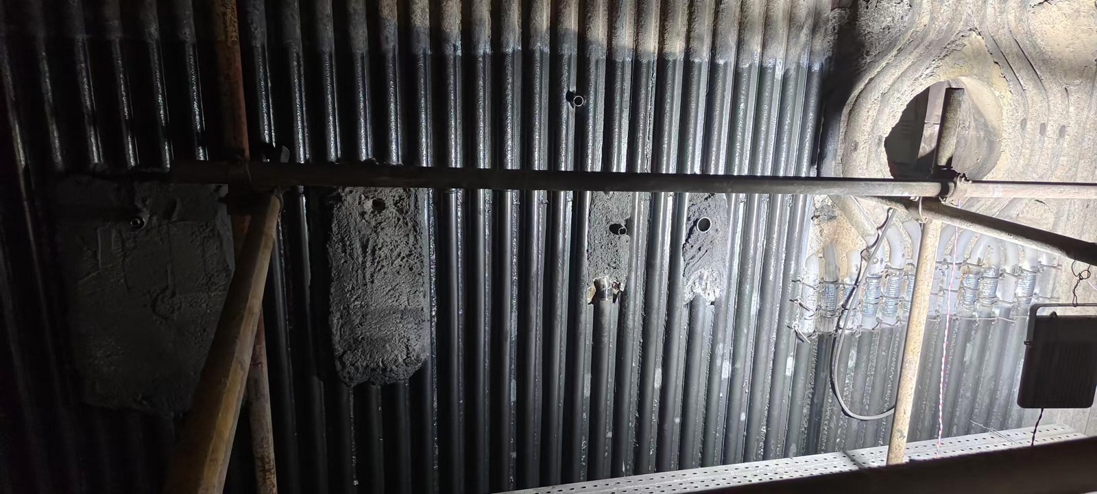 Boiler waterwall around the ammonia-injection port