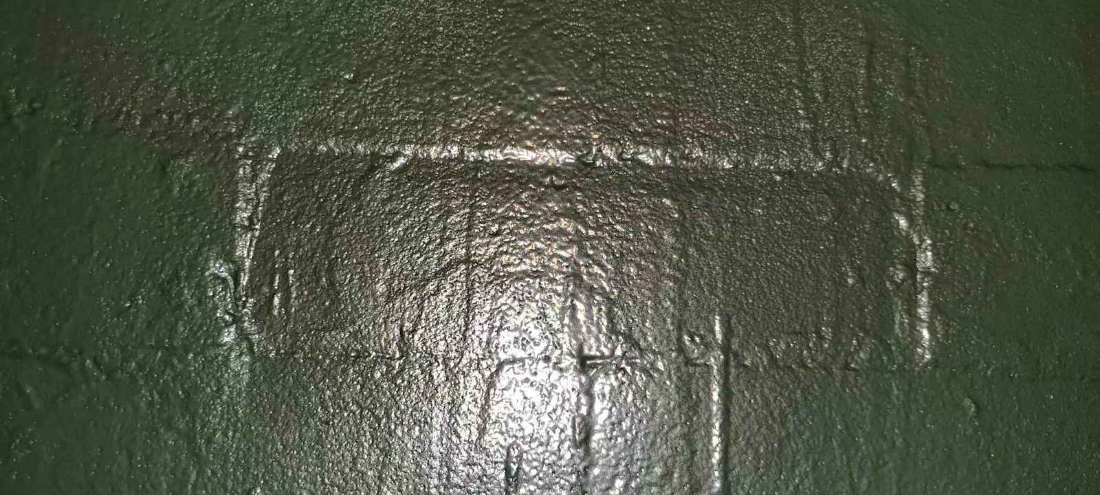 Close-up of the intact ceramic-metal composite coating after testing